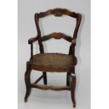 A late 19th/ early 20th century continental beech child's elbow chair and a Cairene small wall