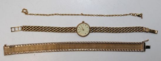 A lady's 9ct gold Rotary wristwatch with a 2.5cm champagne baton dial on a 9ct gold curb link