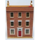 A large Dolls house in the form of a mid 18th century townhouse having eight sash windows and