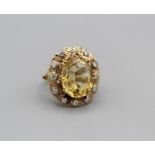 A Victorian citrine and diamond cocktail ring in ornate setting, gross weight approximately 7 gms,