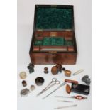 A Victorian walnut needlework/jewellery box containing various collector's items including straw