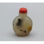 Snuff Bottle. Chalcedony of rounded rectangular form on a raised oval footrim, tao tie mask