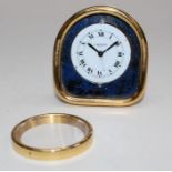 Cartier, Paris, a gilt metal and simulated lapis lazuli cased travelling alarm clock numbered 7504