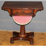 An early 19th century simulated rosewood work table, the rectangular top over frieze drawer and