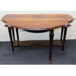 An Edwardian rosewood Pembroke table, the shaped re-entrant oval top raised on slender cabriole legs