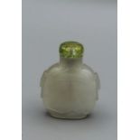 Snuff bottle. Pale translucent grey agate of rounded rectangular form with a slightly flared neck