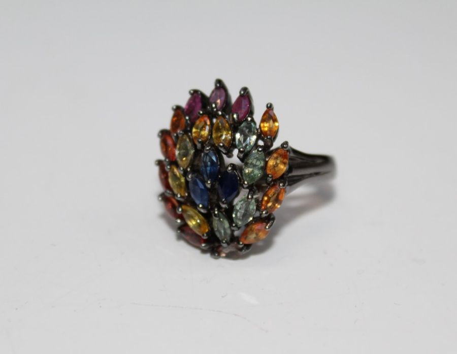 A multi coloured sapphire and ruby 925 stamped cocktail ring, size Q, gross weight approximately 7.