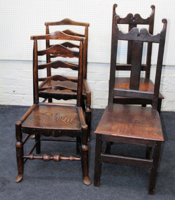 A pair of early 19th century beech and elm ladderback dining chairs, each with solid seat on