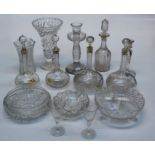 Twelve globular, mallet form and other cut glass decanters(two lacking stoppers) together with a