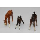 A Beswick figure 1085 foal in gloss brown, H9cm, a Beswick model 946 foal in gloss light brown,