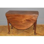 A George III walnut gateleg table, the oval flaptop raised on turned tapered legs and pad feet,