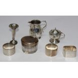 Harold Child, a small silver baluster form loop handled sparrow beak cream jug, 7cm, London 1910