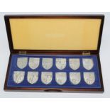 Set of twelve single ingots The Royal arms collection produced by The Danbury Mint 1976, the set