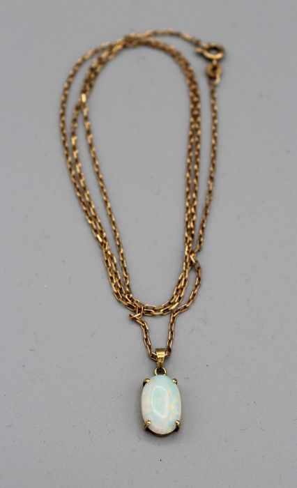 An Australian opal 14k stamped pendant on a 20'' 9ct gold hallmarked chain, 9ct 3gm