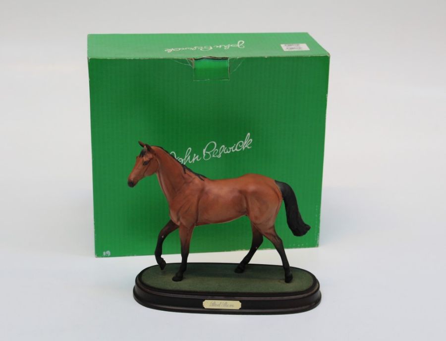 A Beswick style figure of Red Rum raised on a plinth with box, h23cm