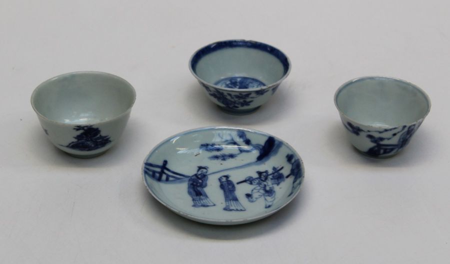 A 19th century Chinese porcelain tea bowl and saucer, figurally decorated in underglaze blue