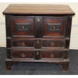 A 17th century oak chest, the rectangular planked top over single deep and two shallow long