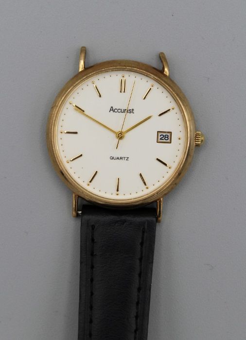 A 9ct gold Accurist wristwatch on a part leather strap. Quartz movement