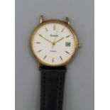 A 9ct gold Accurist wristwatch on a part leather strap. Quartz movement