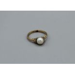 A 9ct gold cultured pearl dress ring, 2.2gm approximately, size M1/2