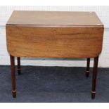 An early 19th century mahogany Pembroke table, the reeded top over single drawer on square