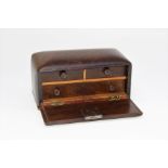 A small, early 20th century rosewood jewellery box, the fall front enclosing two short and single