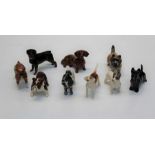 A group of ten Beswick figures of dogs, a Rottweiler, H8cm, a Bulldog H6.5cm, a Cocker Spaniel,