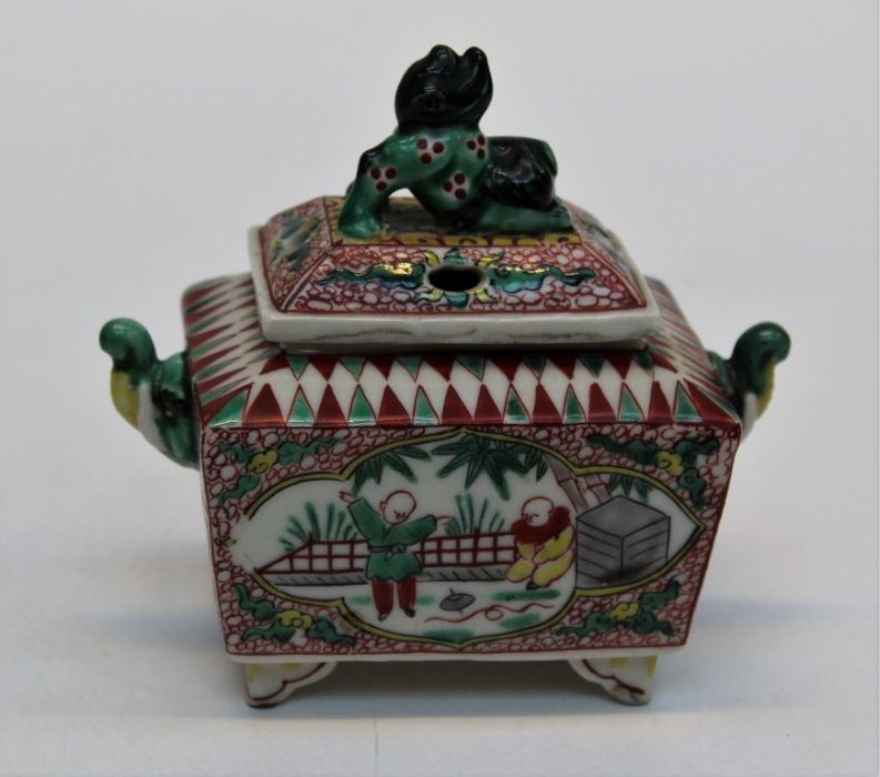 A 20th century Oriental porcelain pot pourri and cover of sarcophagus form with kylin finial,