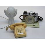 A circa 1980's butter coloured plastic push digit telephone together with a lamp of similar