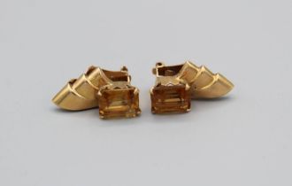 A pair of Art Deco style citrine ear clips. In unmarked yellow metal