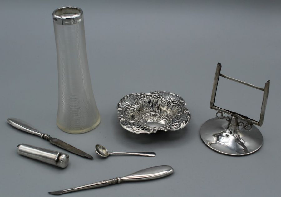 A selection of sterling silver, comprising a pierced work pin dish, a Chester hallmarked card