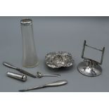 A selection of sterling silver, comprising a pierced work pin dish, a Chester hallmarked card