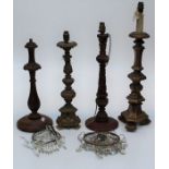 Three turned wood and one composition table lamp bases, the largest 66cm (excluding fittings)