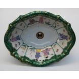 A mid 20th century Italian porcelain sink by Sherle Wagner,  of lobed oval form, internally