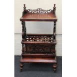 A Victorian walnut Canterbury whatnot with three quarter gallery top, base drawer, on turned legs