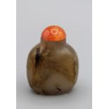 Snuff Bottle. Chalcedony of rounded rectangular form on a broad footrim, carved in low relief