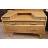 A 1960s G-Plan light mahogany Dressing Table and matching Chest of Drawers with five drawers