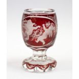 A Bohemian etched red flash glass goblet, with cherub design, 4.5" high approx in good condition