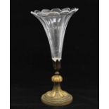A Baccarat style glass lobed trumpet shaped vase on gilt metal stand
