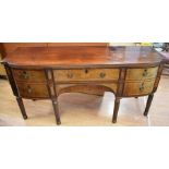 Late George IV/Regency, mahogany and walnut sideboard with a central drawer above a cutlery