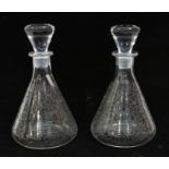 Baccarat for Thomas Hine & Co: A pair of etched decanters with birds, deer and foliage decoration to