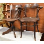 Two early 20th Century chairs - an oak office chair along with a bentwood chair