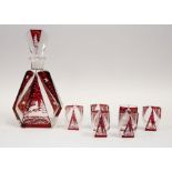 A Czech/Bohemian Art Deco ruby flash glass etched with stag and foliage design decanter and six