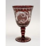 A Bohemian red flash glass chalice with etched Chateau and stag detail, 21cms high x 13cms wide