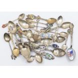 A collection of 20th Century Continental silver souvenir spoons, all with enamelled decoration and