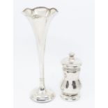 A George VI silver pepper mill, London 1938 and a silver trumpet vase, weighted (marks are rubbed)