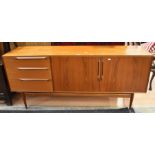 A 1970s teak McIntosh Sideboard with three end drawers and two cupboard doors - 175cm x 46cm.