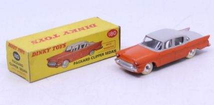 Dinky: A boxed Dinky Toys, Packard Clipper Sedan, Reference No. 180, two-tone orange and grey.