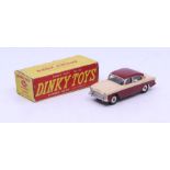 Dinky: A boxed Dinky Toys, Humber Hawk (with Windows), Reference No. 165, beige and maroon two-