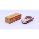 Dinky: A boxed Dinky Toys, Humber Hawk (with Windows), Reference No. 165, beige and maroon two-